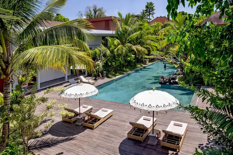 Swimming pool and tropical garden at The Hava Ubud